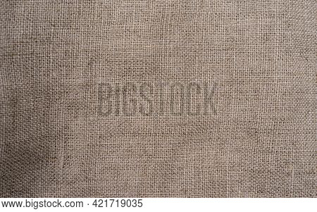 Old Vintage Linen Cloth Textile. Burlap Rustic Texture For Background. Hessian Sackcloth Woven Fabri