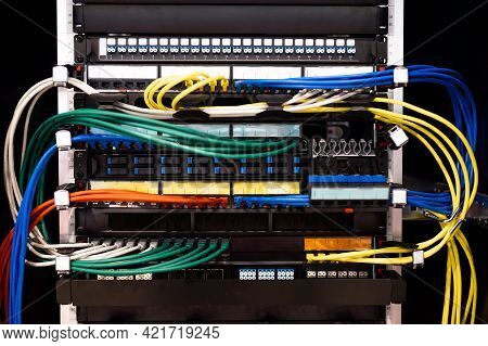 Multi-colored Rows Of Network Cables Are Connected To The System