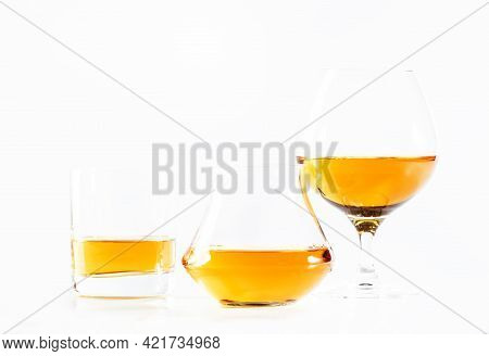 Hard Strong Alcoholic Drinks, Spirits And Distillates In Glasses In Assortment: Vodka, Cognac, Scotc