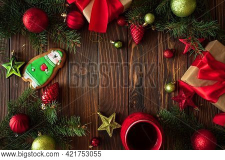Hot Christmas Tea With Gingerbread Cookie On Wooden Table. Top View. New Year And Christmas Celebrat