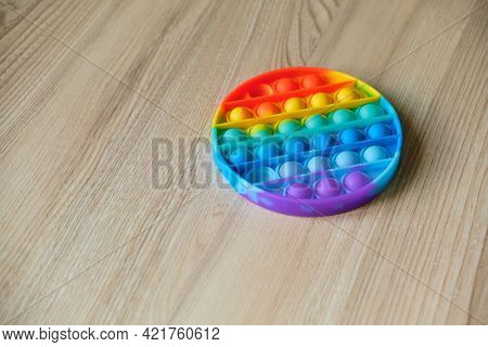 Rainbow Pop It Fidget Toy On The Table