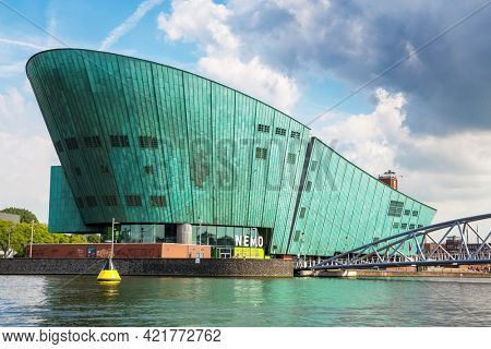 Amsterdam, Netherlands - 7th July 2014: The Nemo Science Museum on the waterfront and located in the Oosterdokseiland neighbourhood. Designed by Renzo Piano and opened in 1997.