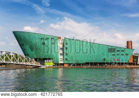 Amsterdam, Netherlands - 7th July 2014: The Nemo Science Museum on the waterfront and located in the Oosterdokseiland neighbourhood. Designed by Renzo Piano and opened in 1997.