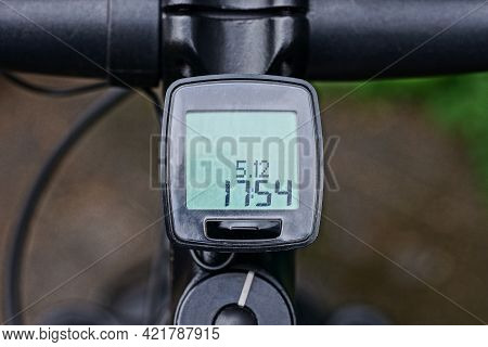 Electronic Bike Computer On A Black Metal Sports Bike Handlebar On The Street