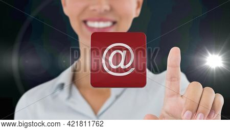 Composition of smiling businesswoman touching screen with digital email icon. business, technology, digital interface and communication concept digitally generated image.