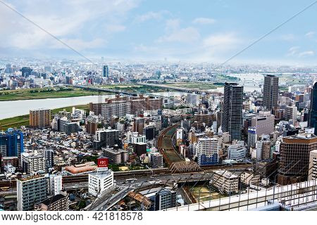 Osaka, Japan - 18 May, 2015: View From Above On Osaka City With Skyline With Skycrapers, Highways An