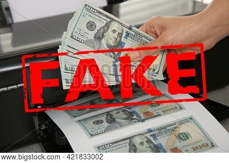 Counterfeiter Printing Fake Dollar Banknotes, Closeup Wiev