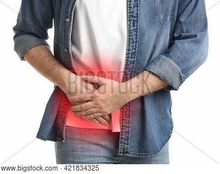 Man Suffering From Acute Appendicitis On White Background, Closeup