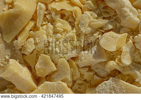 Pieces Of Crushed Cocoa Butter. Chopped Cocoa Oil, Natural Ingredient In The Pharmaceutical And Medi
