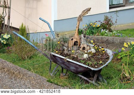 Heavily Used Retro Vintage Wheelbarrow Construction Cart Remade To Be Used As Garden Decoration With