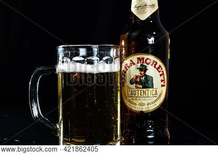 Can Of Birra Morreti Beer And Beer Glass On Dark Background. Illustrative Editorial Photo Shot In Bu