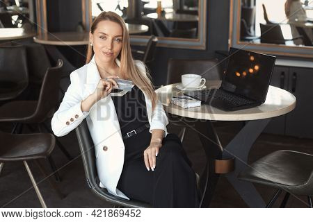 Business Woman Working With Laptop In Cafe, Holging Credit Card