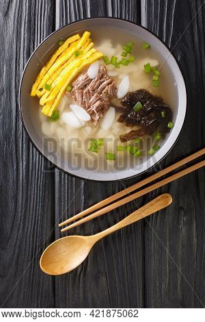 Traditional New Year's Dish Tteokguk Is A Soup Made With Sliced Rice Cakes, Usually In Beef Broth Cl