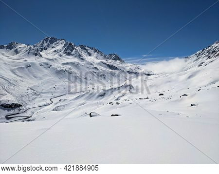 Beautiful Winter Landscape In The Winter Spring Time. Skitour Sentisch Horn. View Of The Auto Fluela