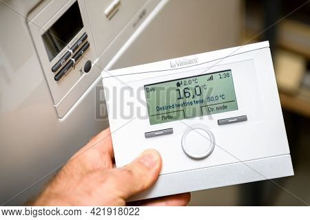 London, United Kingdom - Apr 7, 2021: Pov Male Hand Holding Vaillant Vrc 700 Heating Control Complet