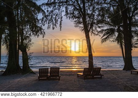 Wooden Chair Beside The Beach With Beautiful Idyllic Seascape Sunset View On Kohkood Island.koh Kood