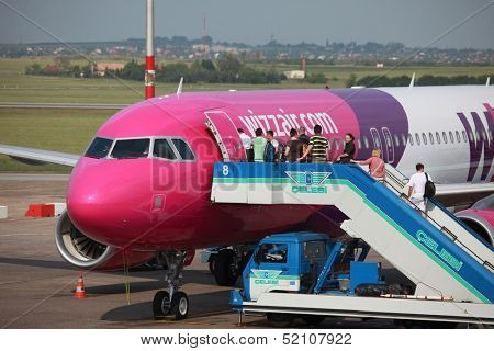 BUDAPEST, HUNGARY - MAY 5: Passengers boarding a Wizzair airliner at Budapest Liszt Ferenc Airport, May 5th 2012. Wizzair is a rapidly growing low-cost carrier based in Hungary.