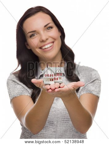 Mixed Race Woman Holding Small House Isolated on White Background - Focus is On The House.
