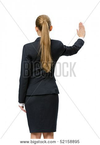 Backview of businesswoman waving her hand, isolated on white. Concept of leadership and success