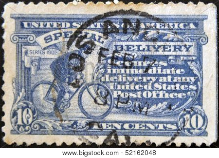 A Stamp Printed In Usa Shows A Postman On A Bicycle, Special delivery