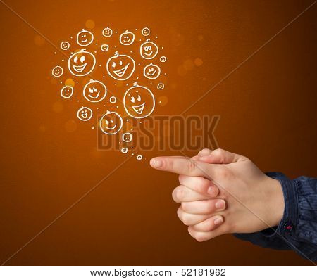 Group of happy hand drawed smiley faces coming out of gun shaped hands
