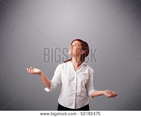 beautiful young lady standing and juggling with copy space