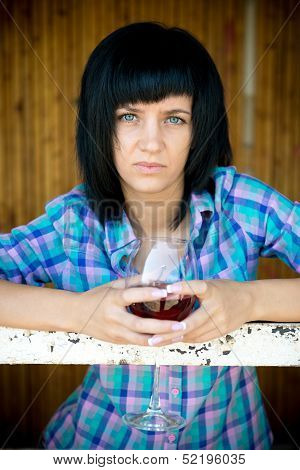 The young girl with a wine glass