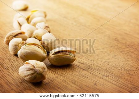 Pistachio nuts on a old kitchen desk.