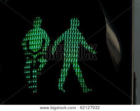 traffic lights for pedestrians and cyclists on a sidewalk or a bike path. green light