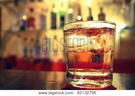 a Glass of whisky on the bar