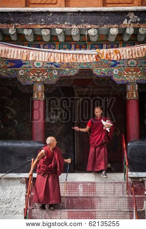 SPITUK, INDIA - SEPTEMBER 6, 2011: Tibetan Buddhist monks ascending the stairs in Spituk monastery. Ladakh, India
