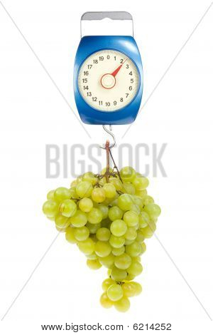 Kitchen Scales And Green Grapes.