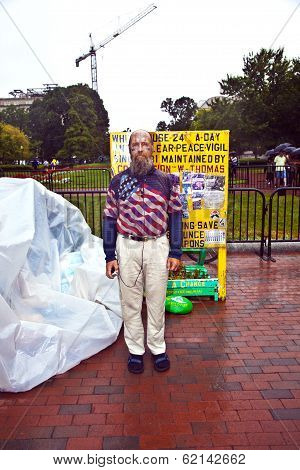Man Is Demonstration In Front Of The White House In Rain For Peace And Against Nuclear Wapons