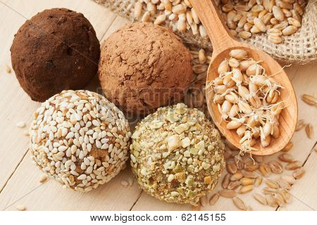 Macrobiotic Healthy Food: Balls From Ground Wheat Sprouts With Sesame, Pumpkin Seeds, Cocoa And Choc