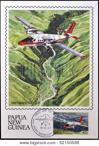 A stamp printed in Papua shows A DHC Twin Otter in flight over of highlands of Papua New Guinea