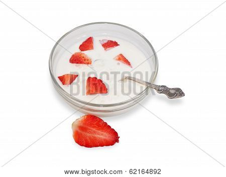 Transparent Bowl With Cottage Cheese And Sliced ??strawberries And Silver Spoon Isolated