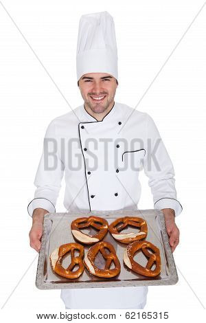 Portrait Of Happy Bakerman With Tray