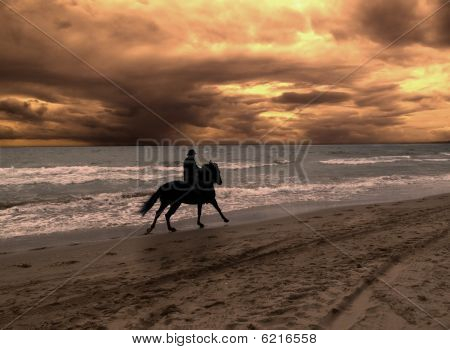 On horseback in dramatic sunset