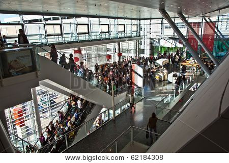 Visitors Inside The Fair Hall On Moving Staircase