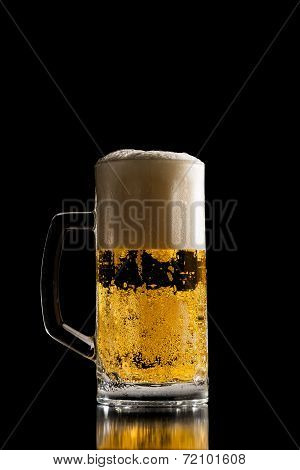 Full Tankard Of Chilled Beer With A Frothy Head