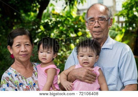 Portrait Of A Happy Extended Asian Family