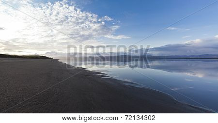 Black sand beach at the Icelandic River Olfusa