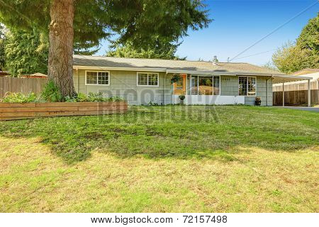 House Exterior. Entance Porch With Yellow Door And French Windows