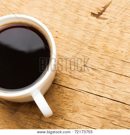Coffee In White Ceramic Cup On Wooden Table - View From Top