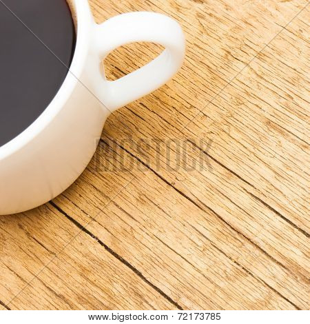 White Ceramic Coffee Cup On Wooden Table - View From Top