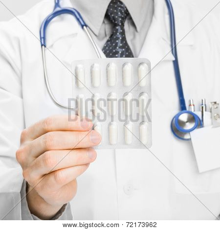 Doctor Holdling Pills In His Hand - Heath Care Concept