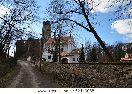Old Restored House With Ruins Of The Okor Castle