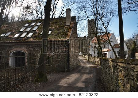 Old Restored House With Ruins Of The Okor Castle