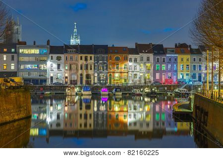 River Leie, colored houses and Belfry tower in Ghent, Belgium