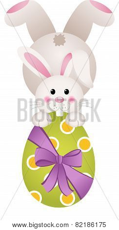 Easter bunny holding a large chocolate egg